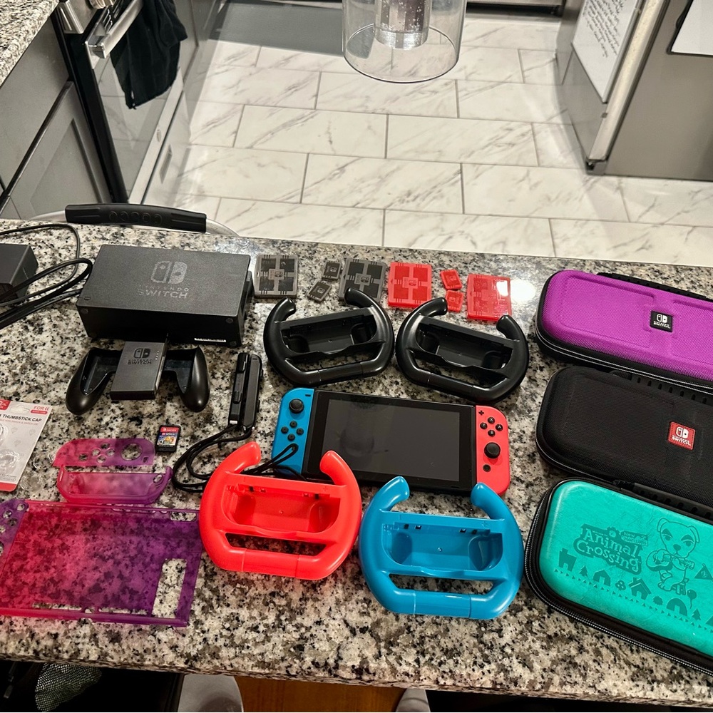 Nintendo Switch with Red and Blue Joy-Cons and Accessories
